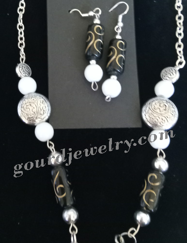 closeup of chain and earrings