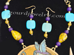 closeup of chain and earrings