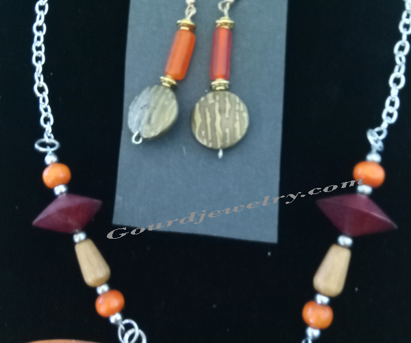 close up of chain ad earrings